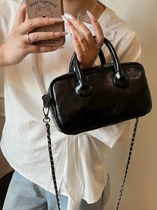 Glossy black patent leather Boston bowling bag with chain strap and embossed logo