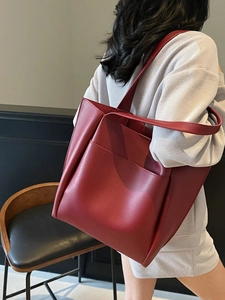 Minimalist burgundy large leather tote bag for women with exterior front pocket