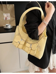 Chic cream multi-pocket tote bag with silver chain details and spacious design