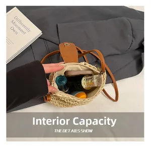 Detail view of woven straw bucket bag interior showing capacity for small cosmetics