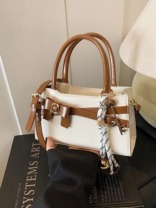 Schicke zweifarbige Handtasche in Creme und Braun mit Schleife und Golddekor