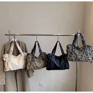 Minimalist large leather tote bags in solid colors and leopard print with metal rivets