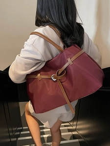 Large burgundy nylon tote bag with brown straps and silver metal buckle decoration