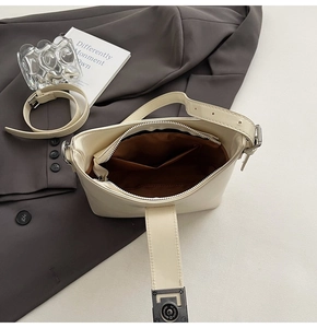 Top view of cream PU leather shoulder bag showing interior lining and silver hardware