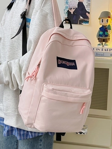 Mochila minimalista de nailon rosa claro de gran capacidad con bordado de logo escolar