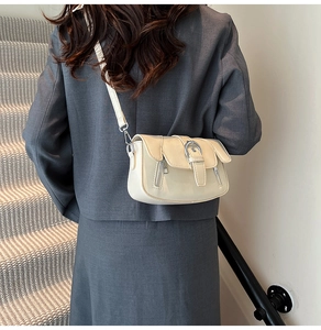 Retro cream white crossbody bag featuring glossy finish and elegant metal buckle