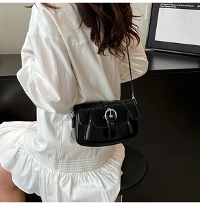 Chic black glossy leather underarm bag with silver ring buckle and side zippers