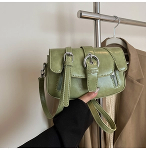 Detailed shot of avocado green PU leather small square bag with silver metal hardware buckle