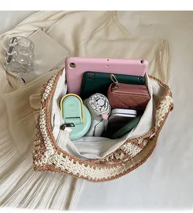 Top view of open crochet tote bag showing spacious interior with tablet and daily essentials