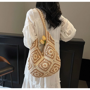 Detail of handmade crochet granny square tote bag in earth tones for beach vacations