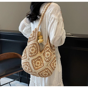 Detailed macro view of granny square crochet tote bag with intricate floral weave patterns