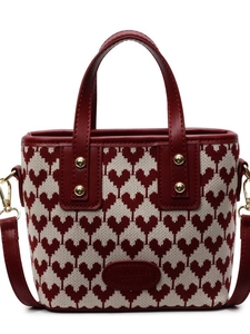 Elegant red heart patterned bridal handbag with gold hardware on white background