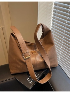 Vintage brown hobo tote bag in premium faux leather with adjustable strap and metal logo