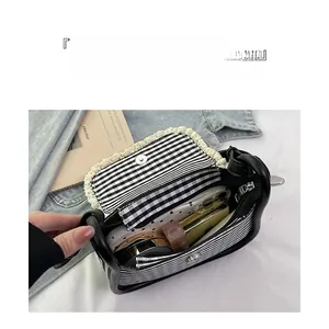 Top view of striped canvas bag interior with lace trim and daily essentials storage