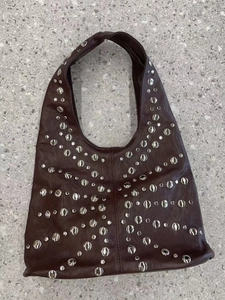Bordeaux red leather hobo bag with vintage silver stud butterfly pattern and shoulder strap