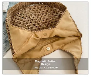 Detail showing the magnetic closure design and yellow fabric lining of straw bag