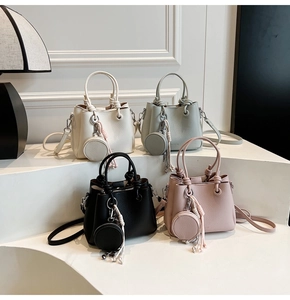 Litchi pattern leather bucket bags with knot handles and round coin purses in four colors