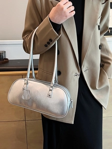 Chic silver metallic underarm bag with a glossy crackle finish and slim straps