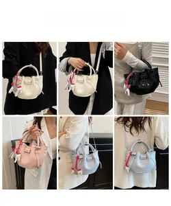 Detailed views of stone-patterned pleated handbags with pegasus charms in six colors