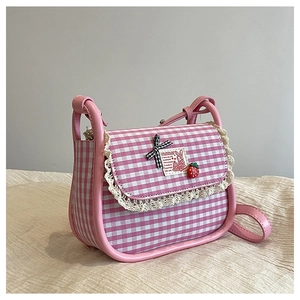Close-up of pink checkered canvas bag with lace edges, bow and strawberry detail