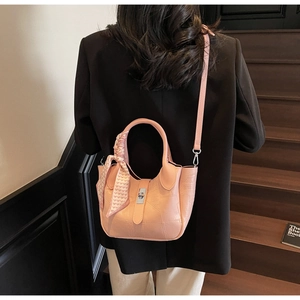Detailed view of pink stone pattern bucket bag with silk scarf and silver metal buckle