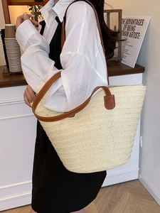 Large capacity straw tote bag with brown leather handles for beach vacation and travel