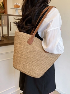 Large capacity straw woven tote bag with brown leather handles for summer beach vacations