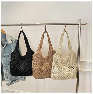 Detail showing handwoven hollow flower pattern on summer beach bags in three colors