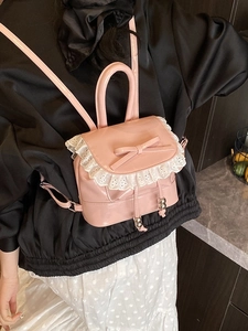 Pink glossy patent leather mini backpack with lace trim and bow for women