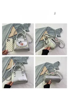 Detail view of silver mini tote bag with lace trim and cute rabbit patch details