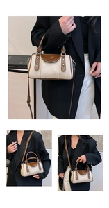 Detail der gewebten Boston Tasche mit braunem Lederbesatz und Nieten im Fotostudio