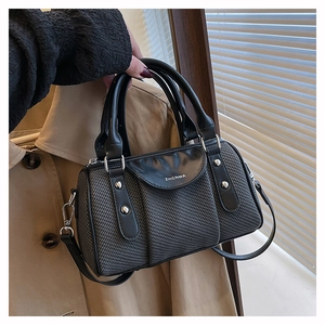 Detail shot of the ZHCNMA grey woven texture Boston bag with black leather handles