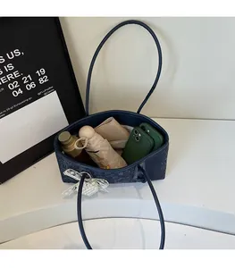 Top view of blue floral tote bag interior showing large capacity for daily essentials