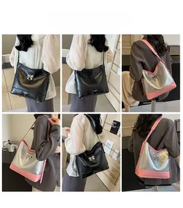 Detail of elegant shoulder bags with metallic bow decoration and adjustable straps