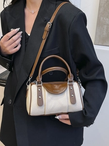 Two-tone woven Boston bag with brown leather trim and adjustable shoulder strap for women