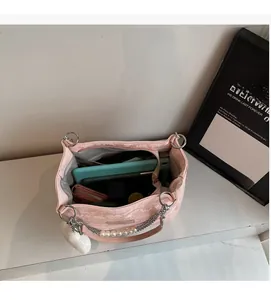 Top view of pink snake-skin tote bag showing large interior capacity with a tablet