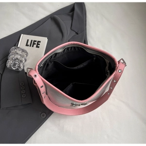 Interior view of a silver and pink shoulder bag showing compartments and lining