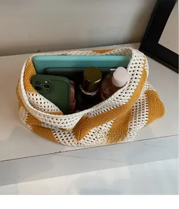 Interior view of spacious knit tote bag showing capacity for tablet and daily items