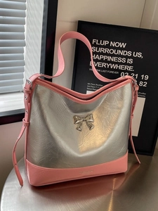 Silver metallic wrinkled tote bag with pink straps and a delicate butterfly bow accent
