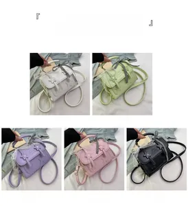 Detail of star patches and lace borders on various colored mini messenger bags