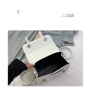 Detailed top view of the white square messenger bag showing spacious inner compartment
