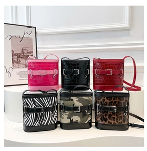 Collection of stylish leopard and crocodile pattern bucket bags with metal buckles