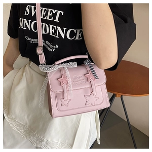 Pink PU leather crossbody bag featuring 3D star stitching and a lace bow detail