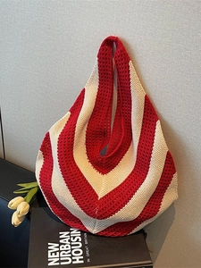 Large knit tote bag with red and white chevron stripes and cutout mesh design for beach