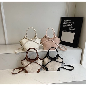 Detailed display of four retro bucket bags in white, pink, and contrast colors with knot handles