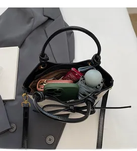 Top view of spacious interior showing storage for phone umbrella and wallet in tote bag