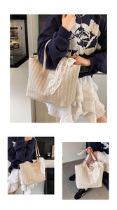 Detail view of woven beach tote bag featuring beige texture and white lace scarf accessory