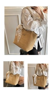 Detail of woven straw tote bag with white lace ribbon and brown leather straps