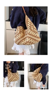 Close-up of bohemian hand-woven hobo bag in beige and brown with leather strap