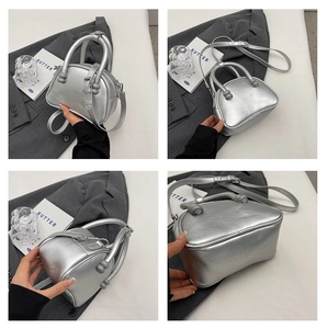 Detailed views of a silver metallic handbag with unique spherical decorative handle joints